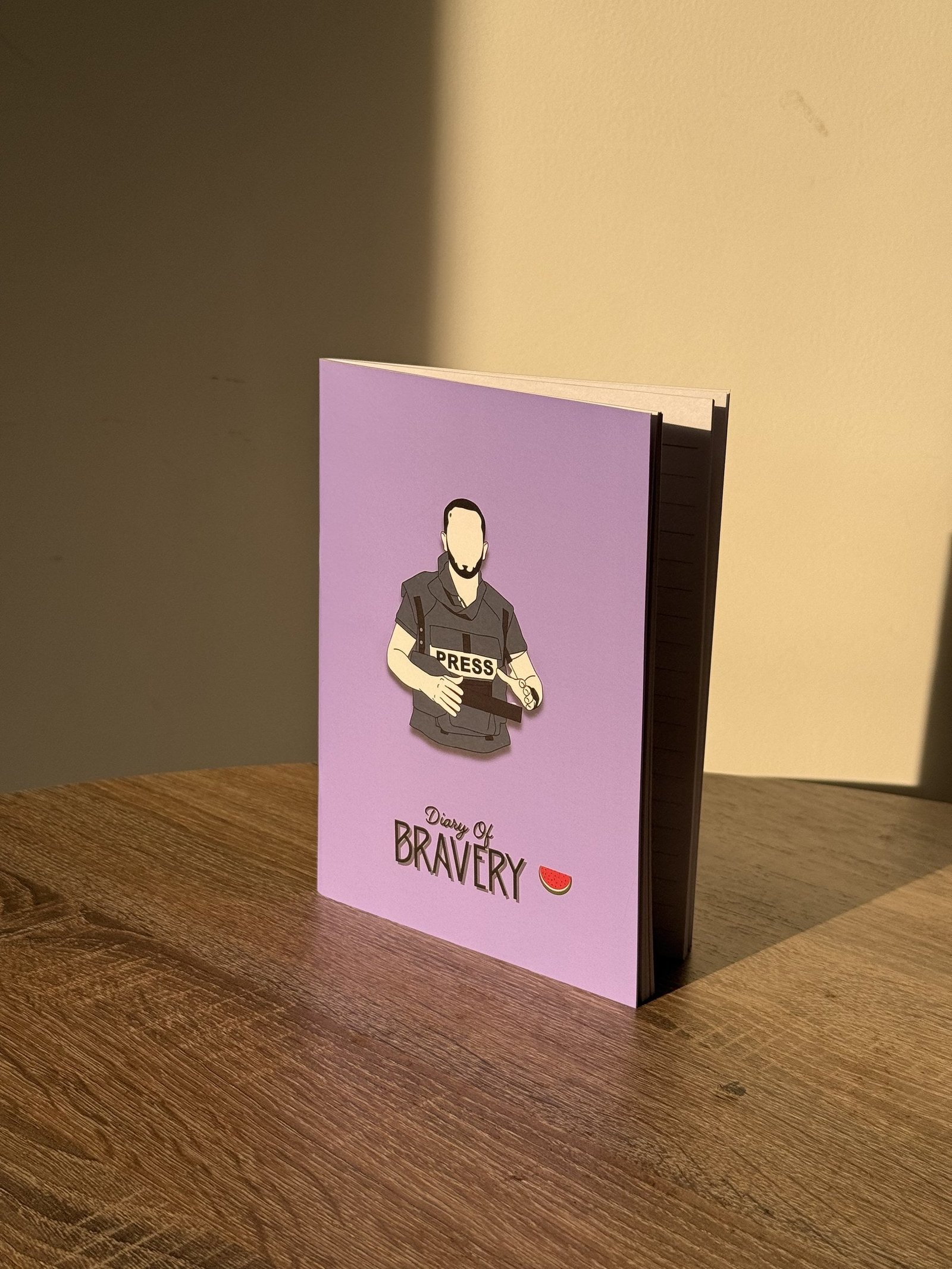 Diary of Bravery Palestine journal, on wooden table