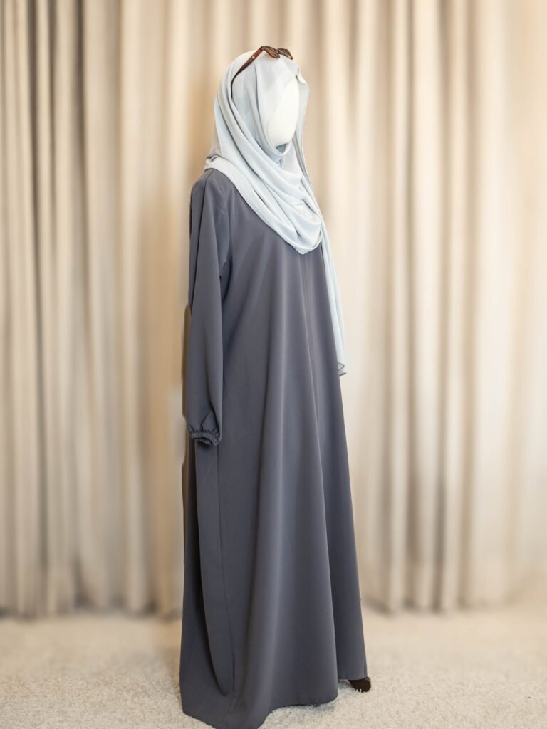 Grey Selma Winter abaya with a pale blue hijab