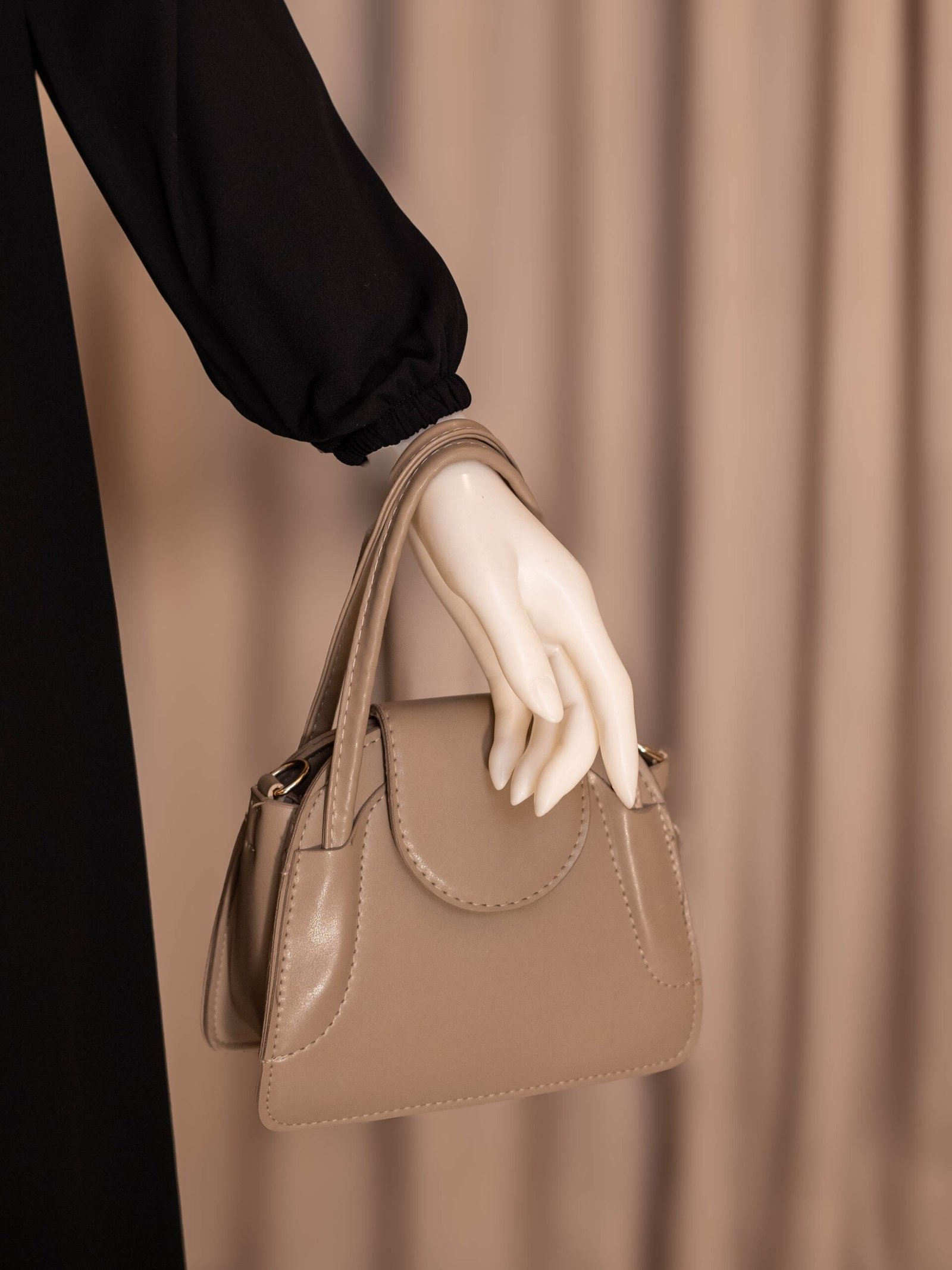 Black Selma everyday Turkish abaya in matte nida, elastic sleeve styled with a handbag