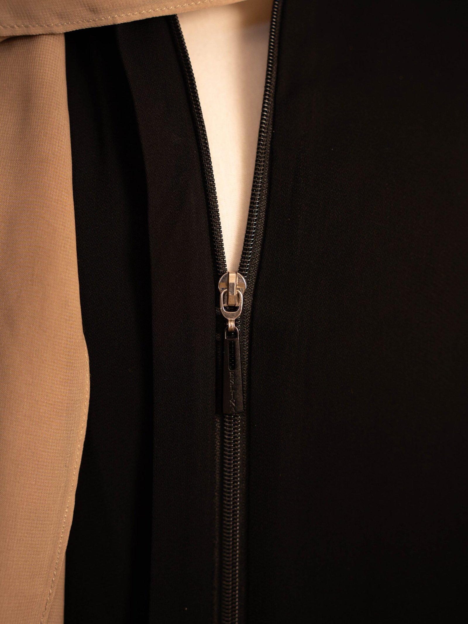 Black Selma everyday Turkish abaya in matte nida, full-length front zip close-up