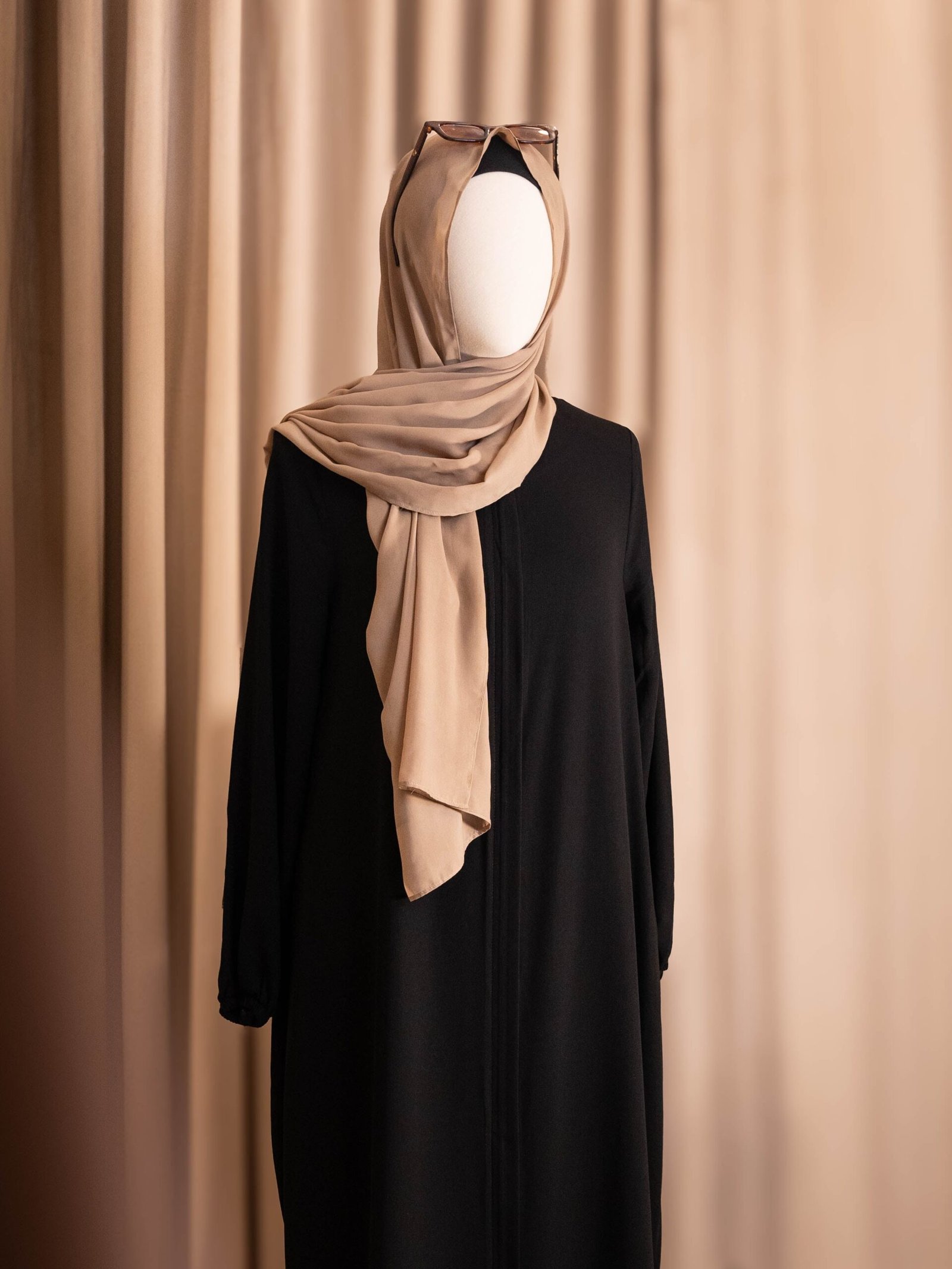Black Selma everyday Turkish abaya in matte nida, full-length front view with a beige hijab