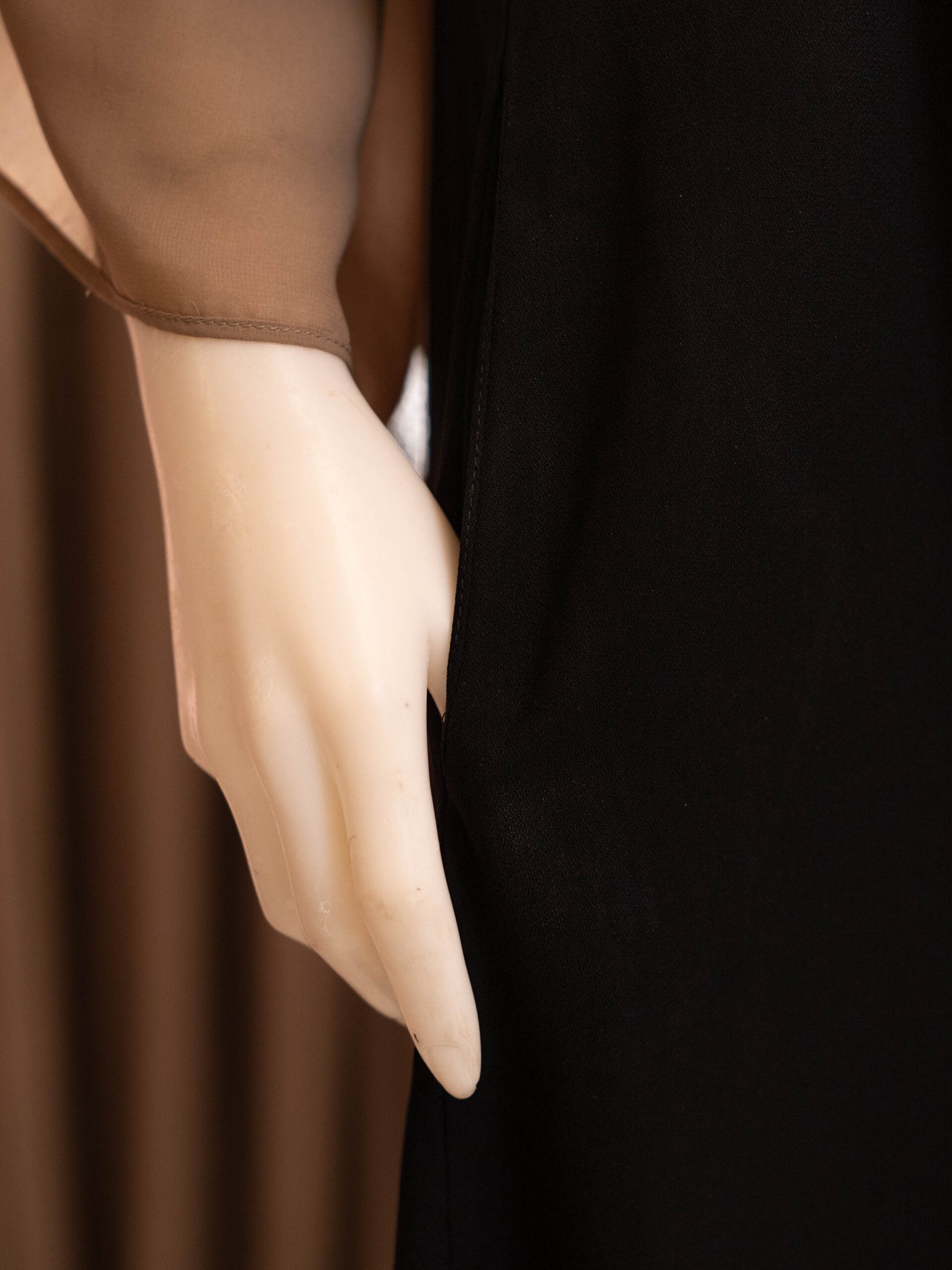 Black Selma everyday Turkish abaya in matte nida, hand in the side pocket