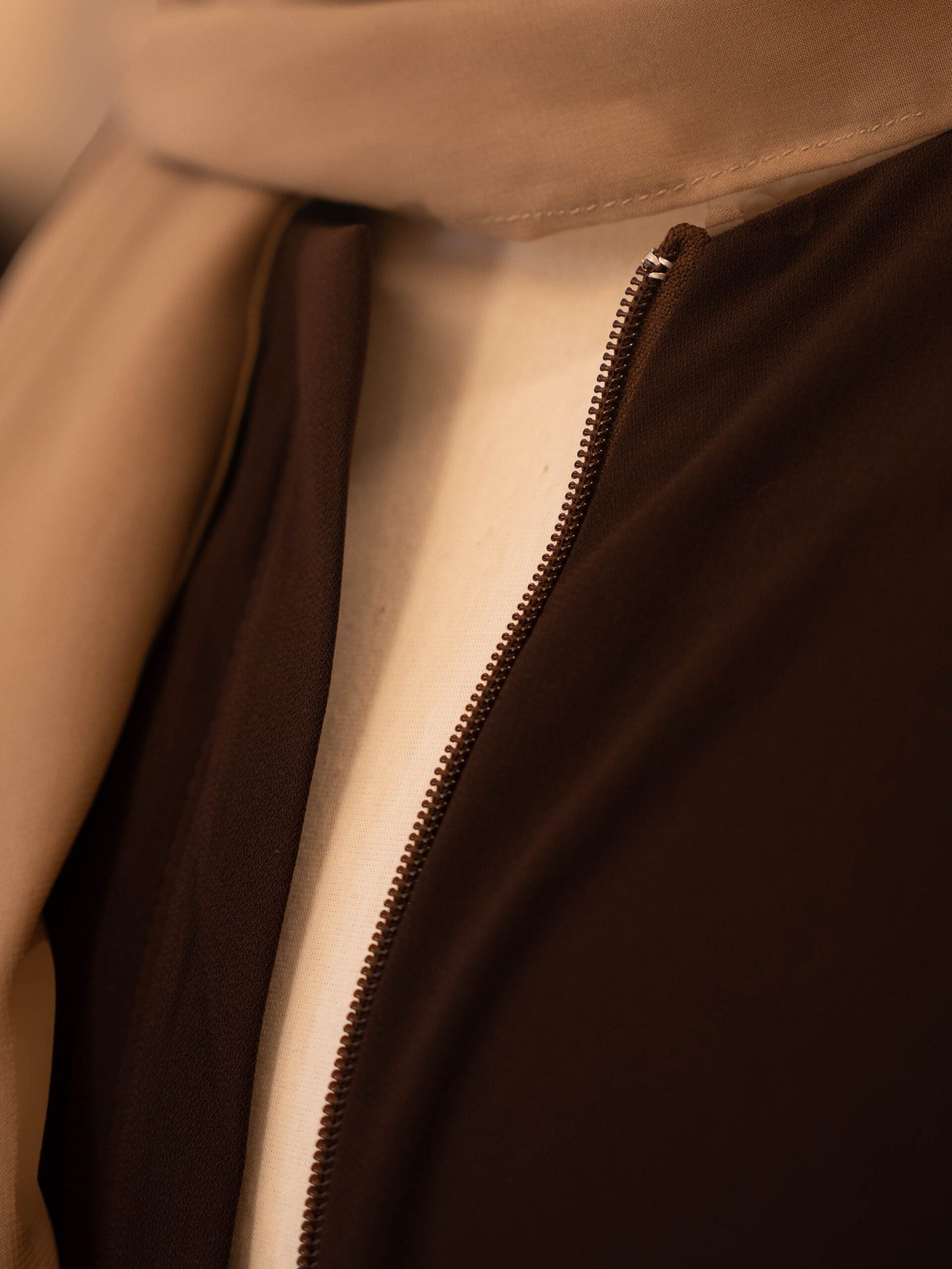 Brown Selma everyday Turkish abaya in matte nida, front zip and neckline close-up
