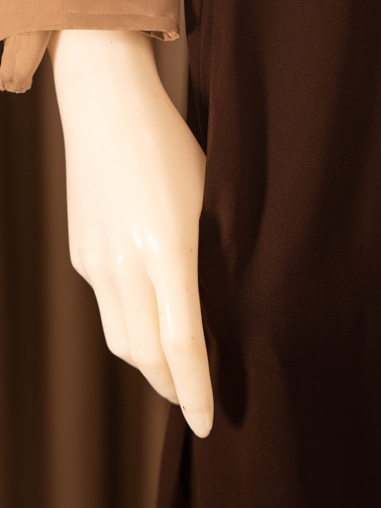 Brown Selma everyday Turkish abaya in matte nida, hand in the side pocket